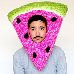 Phil Ferguson aka artist Chili Philly wearing one of his crochet headwear creations, watermelon