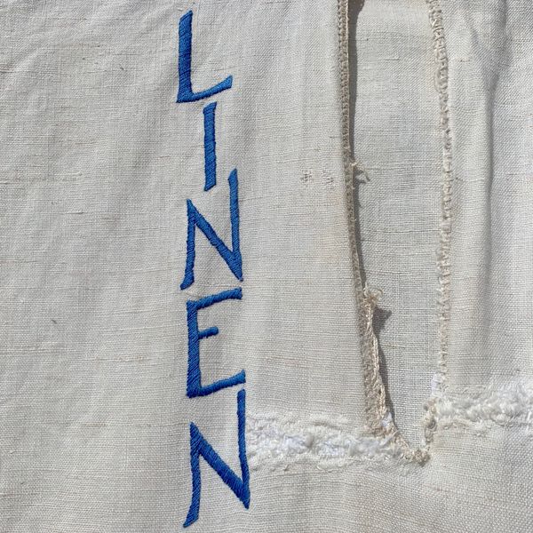 Embroidery detail of the word Linen