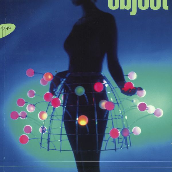 Magazine cover with a female figure wearing skirt made from light bulbs