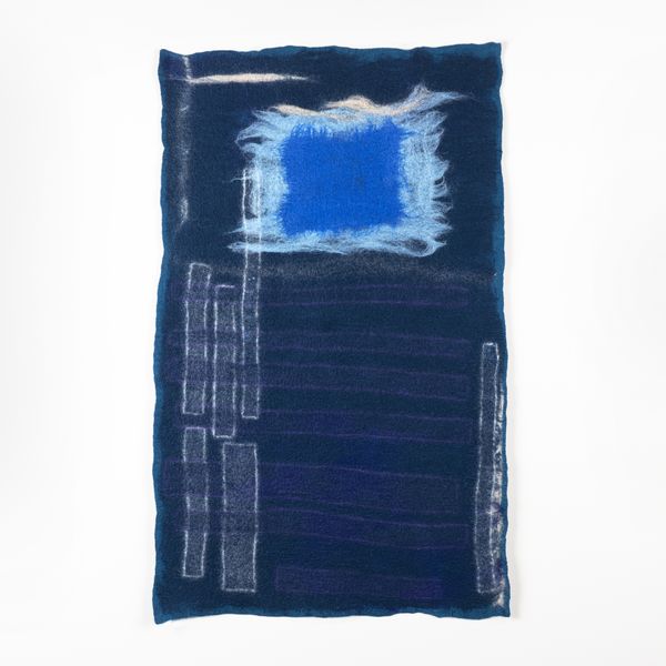 indigo blue dyed fabric with embroidered embellishments
